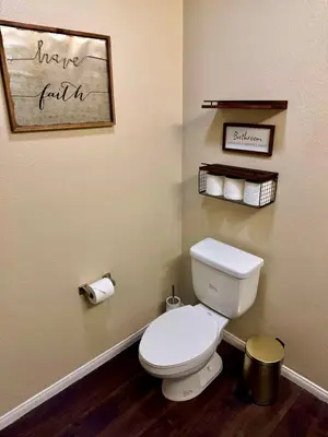 a bathroom with a white toilet in a room at The Luxe Marina HideAway in Los Angeles