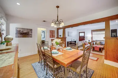a dining room and living room with a table and chairs at Home half Mi to Dtwn Riverside Families Welcome! in Riverside
