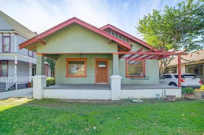 a green house with a red roof at Home half Mi to Dtwn Riverside Families Welcome! in Riverside
