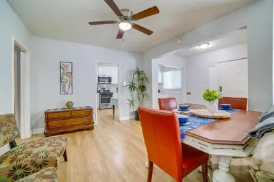 a dining room with a table and a ceiling fan at Family-Friendly Home 2 Mi to Dtwn Riverside in Riverside