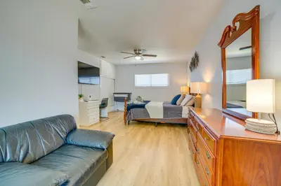 a living room with a couch and a bed at Family-Friendly Home 2 Mi to Dtwn Riverside in Riverside