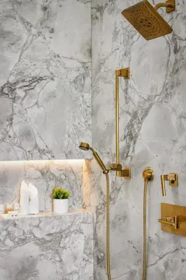 a shower in a bathroom with a marble wall at Mulholland Edition in Beverly Hills