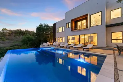 an image of a house with a swimming pool at Mulholland Edition in Beverly Hills