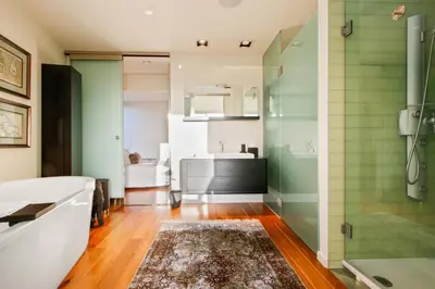 a bathroom with a shower and a sink at The Beverly Aura in Los Angeles