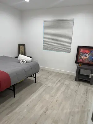 a bedroom with a bed and a television in it at Brand New Home, Great Location, Monthly Discounts in Woodland Hills