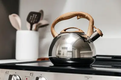 a tea kettle with a basket on top of a stove at Serene Urban Haven in Los Angeles