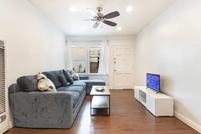 a living room with a couch and a television at Affordable 1BR apt near Beverly Hills in Los Angeles