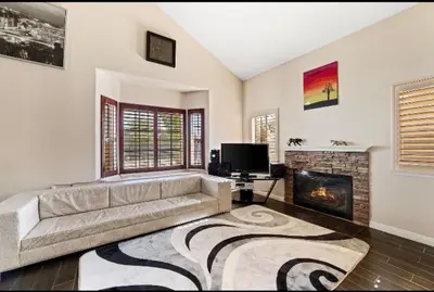a living room with a couch and a fireplace at Peaceful Room in Riverside