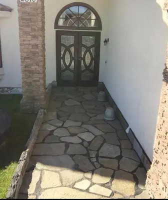 a front door of a house with a stone walkway at Peaceful Room in Riverside