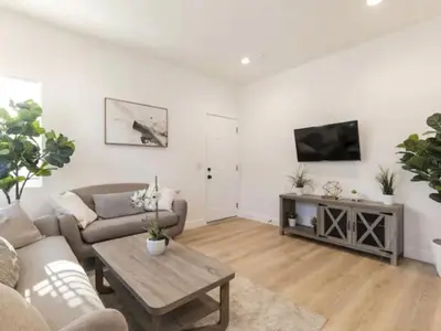 a living room with a couch and a table at Holiday Home Modern Home by Interhome in Westminster