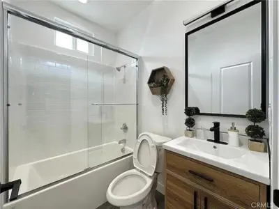 a bathroom with a toilet and a shower and a sink at Holiday Home Modern Home by Interhome in Westminster
