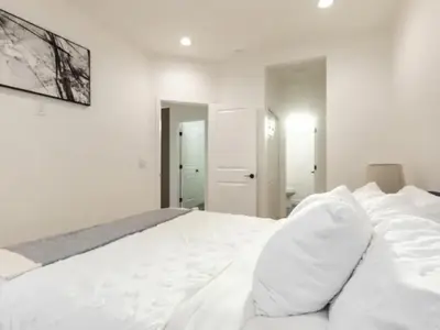 a white bedroom with a large white bed at Holiday Home Modern Home by Interhome in Westminster