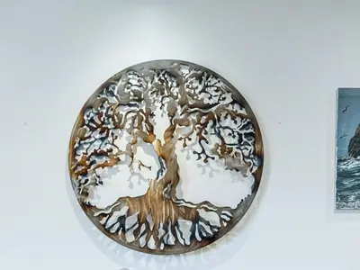 a metal plate with a tree on a wall at Apartment Meerblick Eigentumswohnung gegenüber dem Strand by Interhome in Port Hueneme