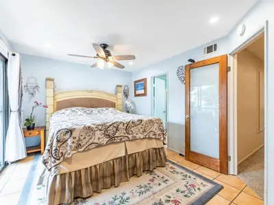 a bedroom with a bed and a ceiling fan at Apartment Meerblick Eigentumswohnung gegenüber dem Strand by Interhome in Port Hueneme