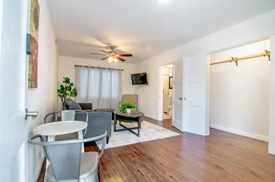 a living room with a table and a couch at Relaxing 1 Bedroom Suite Near Beverly Hills in Los Angeles