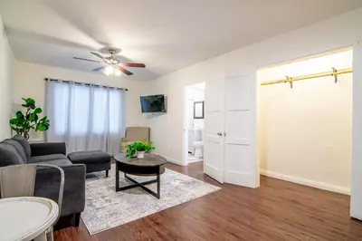 a living room with a couch and a table at Relaxing 1 Bedroom Suite Near Beverly Hills in Los Angeles