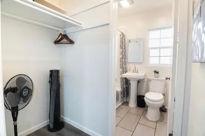 a bathroom with a toilet and a sink at Cozy Studio Suite Near Beverly Hills in Los Angeles