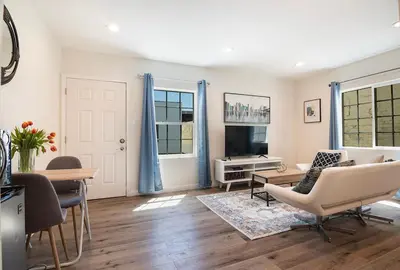 a living room with a couch and a table at Upper-Level Studio Suite Close to Beverly Hills in Los Angeles