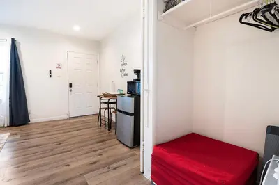 a small room with a bed and a table at Cozy Studio Suite Near Beverly Hills for Two in Los Angeles