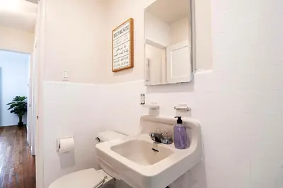 a white bathroom with a sink and a toilet at Affordable One-Bedroom Close to Pico and Beverly Hills in Los Angeles