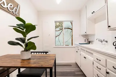a kitchen with a table and a potted plant at Bright Second-Floor Studio Near Beverly Hills in Los Angeles
