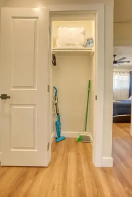 a room with a closet with a door and mop at Southbaysunshine coastal Villa by beach-30 plus Days in Torrance