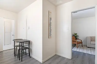 a white room with a table and a chair at Comfortable 1B 2beds Retreat Near Beverly Hills in Los Angeles