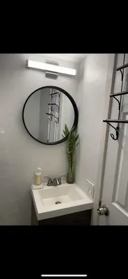 a bathroom with a sink and a mirror at Hidden Gem in San Bernardino