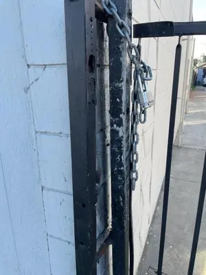 a black pole with a chain attached to a wall at Hidden Gem in San Bernardino