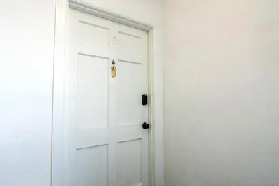 a white door in a room with a white wall at Comfortable 2Bedroom apartment close to Beverly Hills in Los Angeles