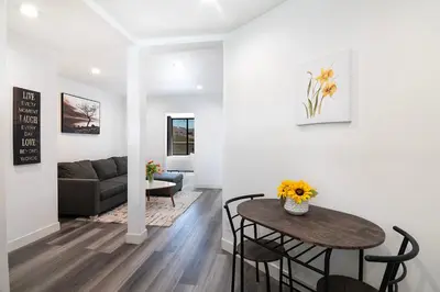 a living room with a table and a couch at Comfortable 2Bedroom apartment close to Beverly Hills in Los Angeles