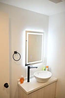 a bathroom with a white sink and a mirror at Calm Luxe Ensuite Room near USC-Shared Home in Los Angeles
