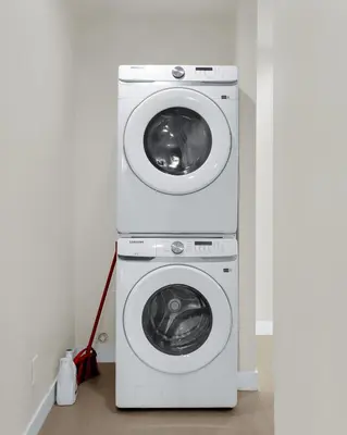 a washer and a washing machine in a room at Stylish LA Retreat Near Disney Knotts SoFi in Paramount