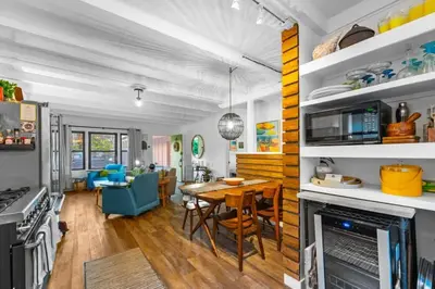 a kitchen and living room with a table and a dining room at Luxe Beachside Escape Near Channel Islands in Oxnard