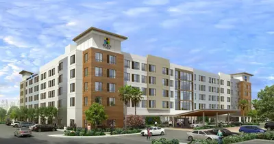 a rendering of a building with cars parked in a parking lot at Hyatt House Ontario Airport in Ontario