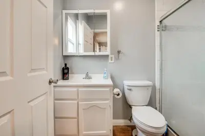 a bathroom with a toilet and a sink and a shower at Melrose Hill Home Near Hospitals Nurses Welcome! in Los Angeles