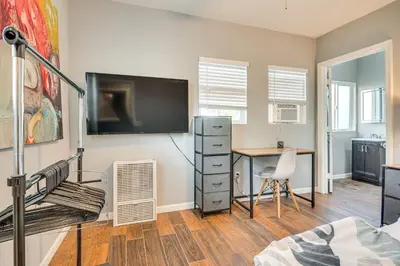 a bedroom with a desk and a tv on a wall at Melrose Hill Home Near Hospitals Nurses Welcome! in Los Angeles