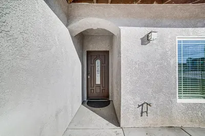 an entrance to a house with a brown door at Fully Updated! Prime Riverside Spot Near Dtwn in Riverside