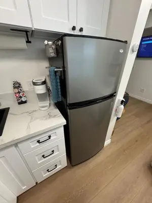 a kitchen with a stainless steel refrigerator in a room at Cozy Villa with Spa, Fireplace, Kitchen, Yard, BBQ in Simi Valley