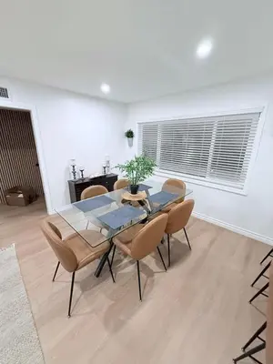 a dining room with a glass table and chairs at 2BR 2BA Home Hot Tub, Firepit, Yard, BBQ, Parking in Simi Valley
