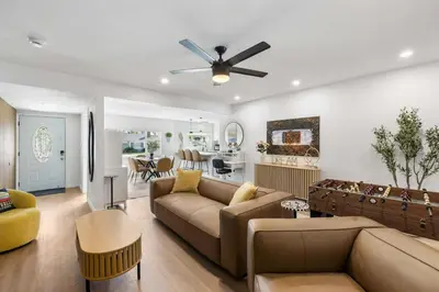 a living room with a couch and a ceiling fan at 2BR 2BA Home Hot Tub, Firepit, Yard, BBQ, Parking in Simi Valley