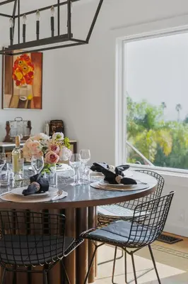 a dining room table with chairs and wine glasses at New Listing Elevated Hillside Living by Colby & Conrad in Los Angeles