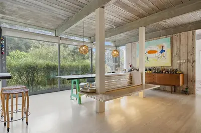 a living room with a bench and a table at New Listing Modern Hollywood Hills Sanctuary by Colby & Conrad in Los Angeles