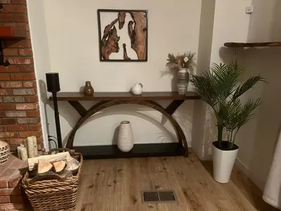 a room with a table with a vase and a plant at Luxury Lakefront Retreat,HotTub,EV Charge,Fire Pit in Big Bear Lake
