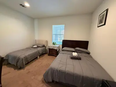 a bedroom with two beds and a window at Cozy 2-Bedroom Home in Eastvale in Corona