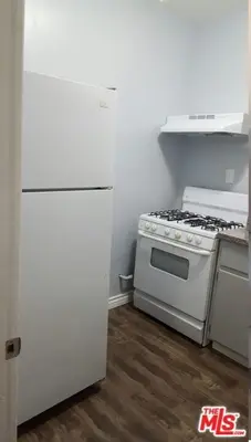 a kitchen with a stove and a white refrigerator at Cozy Studio Apt Studio City Unit 5 in Los Angeles
