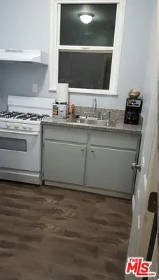 a kitchen with a sink and a stove and a window at Cozy Studio Apt Studio City Unit 5 in Los Angeles