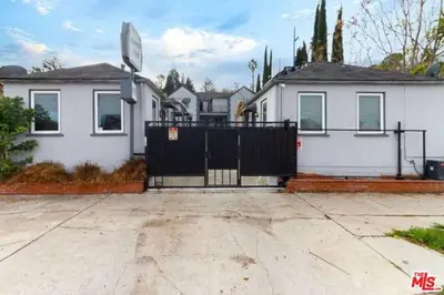 a house with a black gate in front of it at Cozy Studio Apt Studio City Unit 5 in Los Angeles