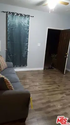 a living room with a couch and a wooden floor at Cozy Studio Apt Studio City Unit 5 in Los Angeles