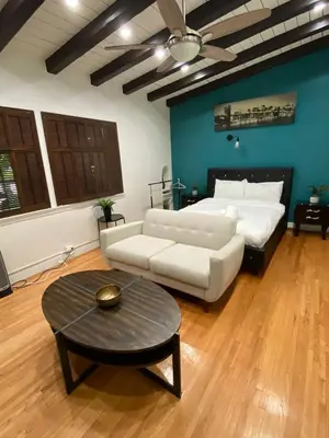 a living room with a couch and a table at Cozy Studio by Rodeo Drive in Los Angeles